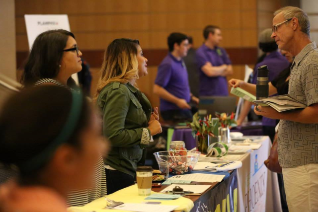Residents speaking with vendors