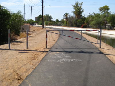 Remove or redesign the gates on canal paths