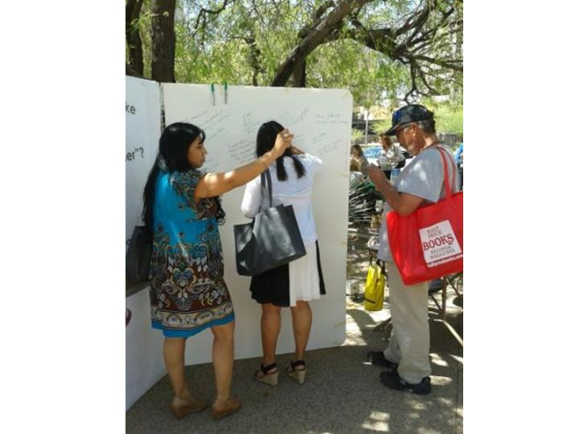 Plan PHX staff discussing ideas at the Earth Day Event held at Cesar Chavez Plaza.