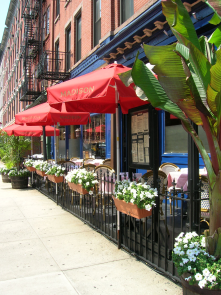A cafe or other eatery with outdoor seating somewhere along Main Street.