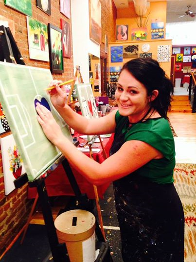 Artist Mandy Burge leads a class of soccer players at Merlot and a Masterpiece.