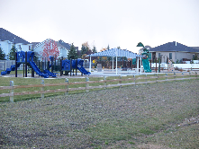 This photo shows a neighborhood park with playground