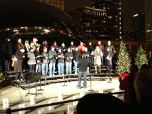 Caroling at Cloud Gate; Chicago, IL -- Caroling lead by a choral group Friday evenings during the Christmas season.