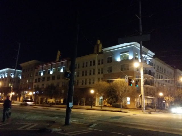 mid-rise urban mixed-use transit and pedestrian oriented development. street front retail, hidden parking.