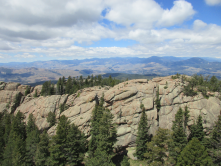 Views to the west from the lookout, looking towards the Hayman burn scar and Lost Creek Wilderness.  USFS photo, Summer 2019. 