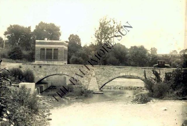 The old bridge  that was next to the old power plant. The dam is on the otherside and it shows a Model T driving across 