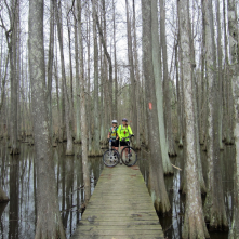 Mountain bikers pause for a photo while riding the trails at Lake Chicot.