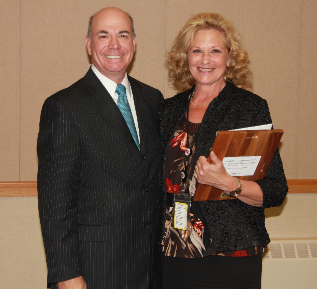 Congratulations to October Employee of the Month, Human Resources Specialist Cindi Alberico! Board Member, Mike Pate, presents her plaque.