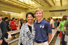 Mrs. Martin, the beloved counselor at Andersen Middle School, with Wolf Lucas at 8th Grade Recognition Night.  