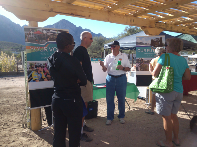 Your Voice volunteer Don Cox chatting with residents at the Oro Valley Farmers Market on 11/2/13