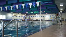 Fitness & Aquatics Center. Indoor pool. Gym with walking track above. Weight Room. CHILD CARE