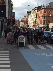 Real bike lanes, lots of bike riders, and cars that defer to bike riders - all peacefully co-existing on the same street