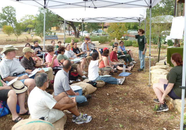 Green Spaces staff teach attendees about permaculture and observing the landscape to work with it instead of against it.